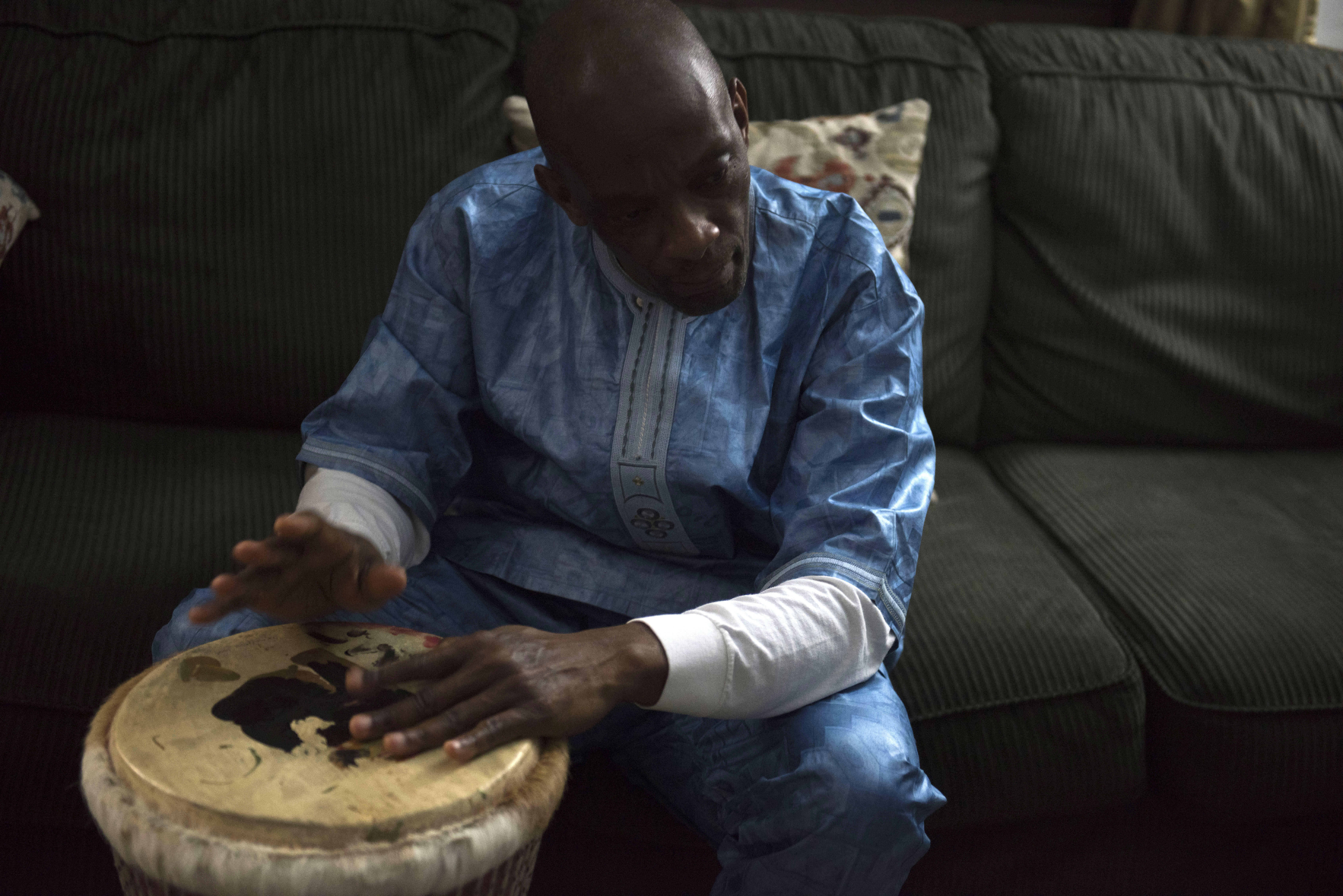 Tamba playing the djembe, one of West Africa's best known music instruments.