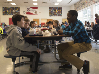 Malik’s lunch break in his school where he socializes with his peers.