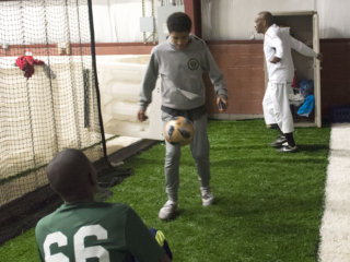 Pre-game warm up: Malik plays with his friend, while Tamba does some dynamic stretches.