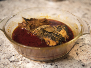 White fish stew, one of the many African meals prepared ahead by Malik’s mother before travelling to Guinea. Given their different schedules, Tamba and Malik are not used to sit and eat together.